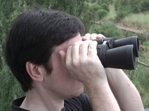 The right way to hold binoculars.